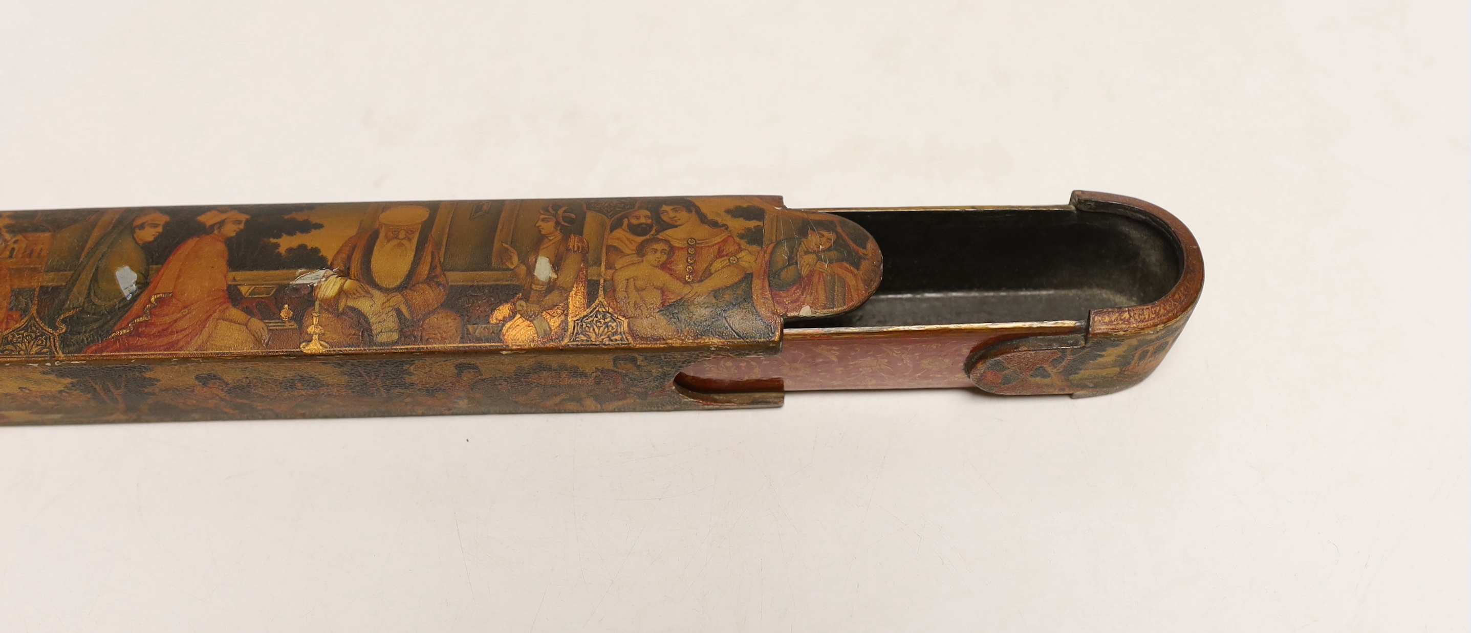 A Persian Qalamdan papier mache scribes or pen box, Qajar dynasty, 22.5cm in length